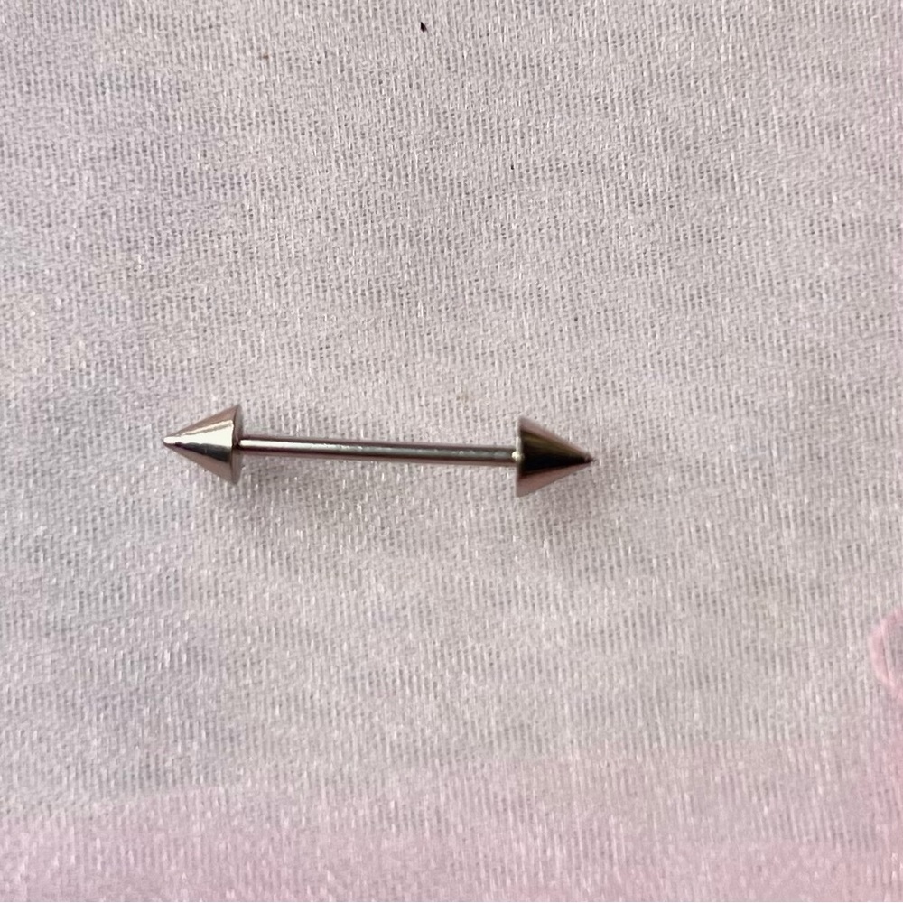 Silver Arrow Barbell piercing